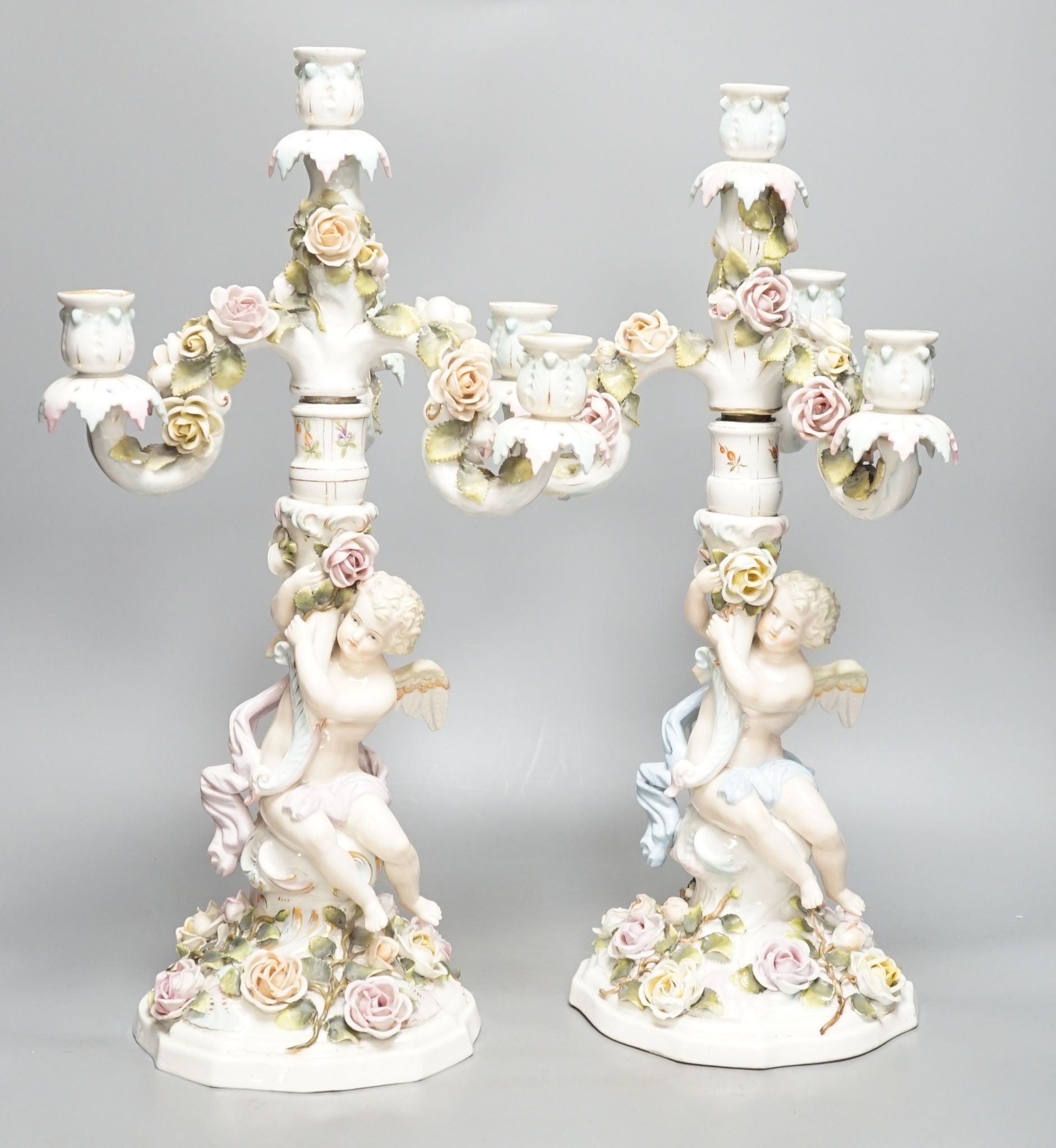 A pair of Sitzendorf 'cherub' candelabra 50cm